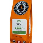 Orange coffee bag with 'Planet Bean Coffee' branding on a white background label that reads Chatty Matty - Ground Coffee