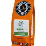 Orange coffee bag with 'Planet Bean Coffee' branding on a white background label that reads Chatty Matty - Whole Bean Coffee