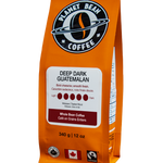 Orange coffee bag labeled 'Planet Bean Coffee' with 'Deep Dark Guatemalan' Whole Bean Coffee on a white background