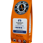 Orange Planet Bean Coffee package with white label on a white background label that reads European Decaf - Whole Bean Coffee