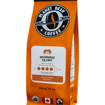 Orange coffee bag labeled 'Morning Glory' Ground Coffee from Planet Bean Coffee on a white background